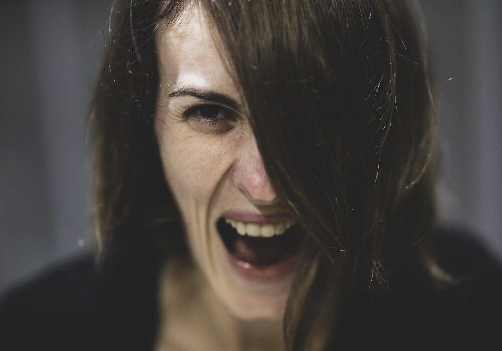 A woman screaming in anger.