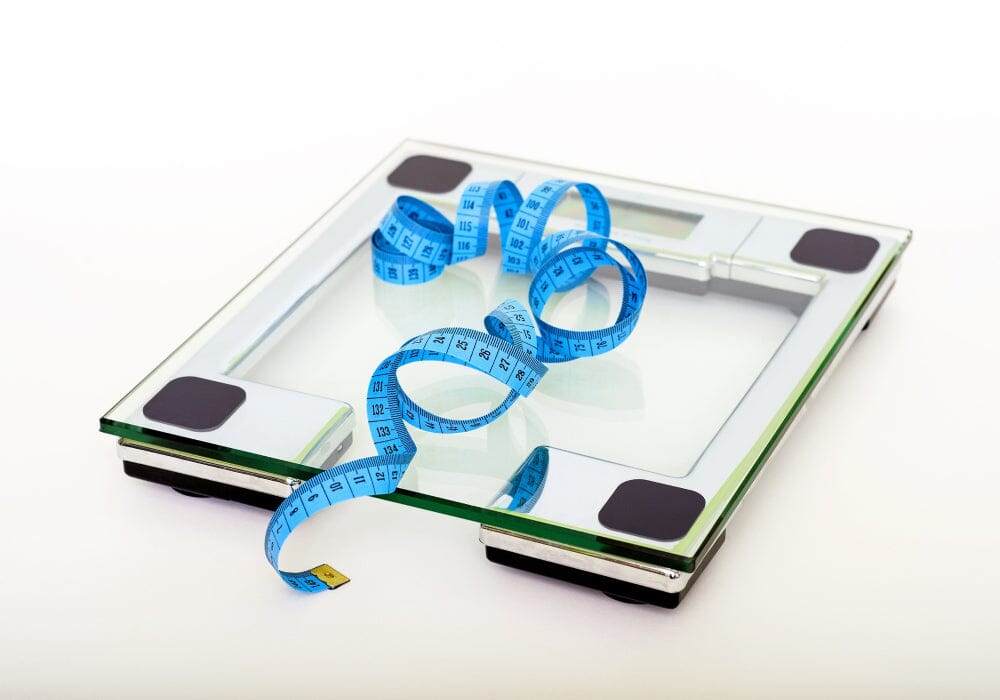 A set of electronic weighing scales and a tape measure