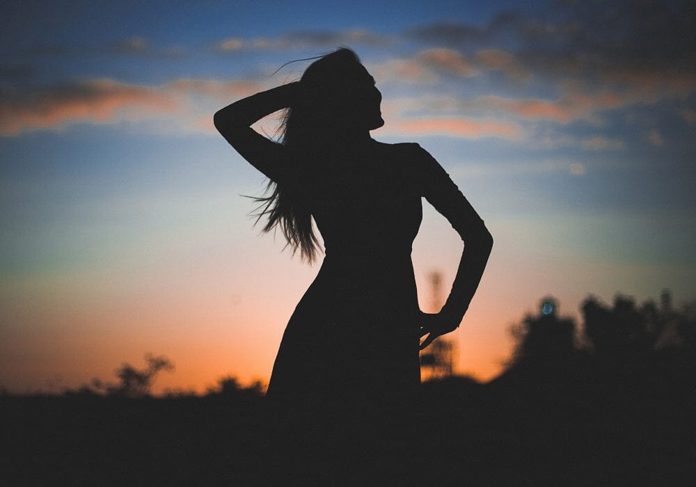 A woman silhouetted against the sky
